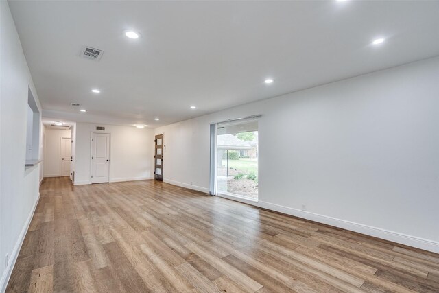 spare room with light wood-type flooring