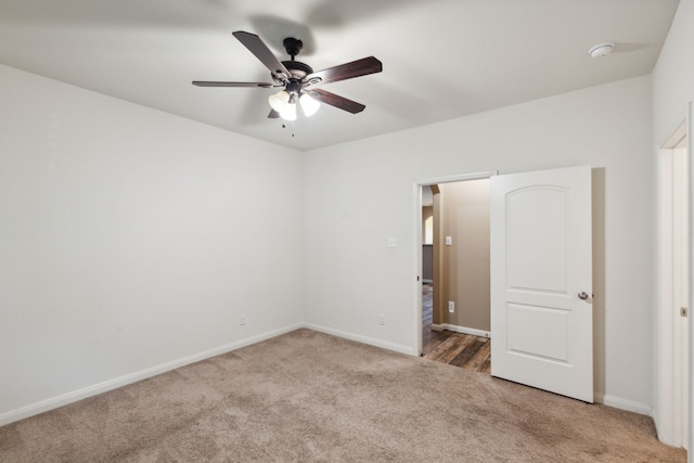 unfurnished bedroom featuring carpet flooring and ceiling fan