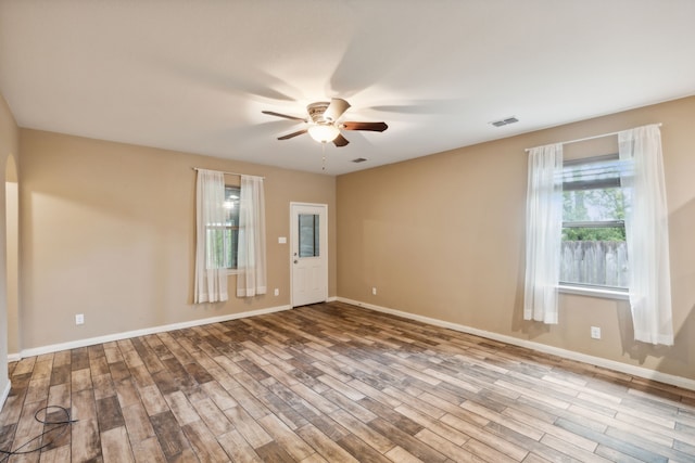 unfurnished room featuring ceiling fan and light wood-type flooring