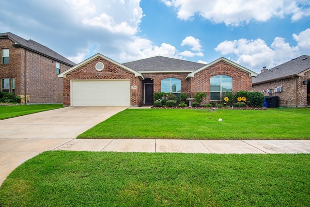 view of front of house with a garage and a front yard