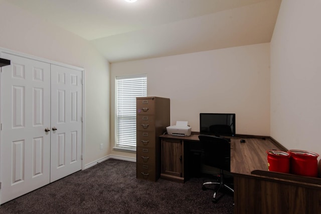 carpeted office featuring lofted ceiling