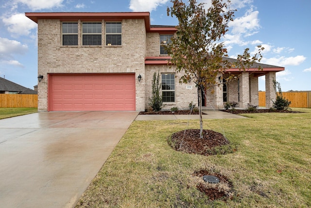 view of front facade with a garage and a front yard