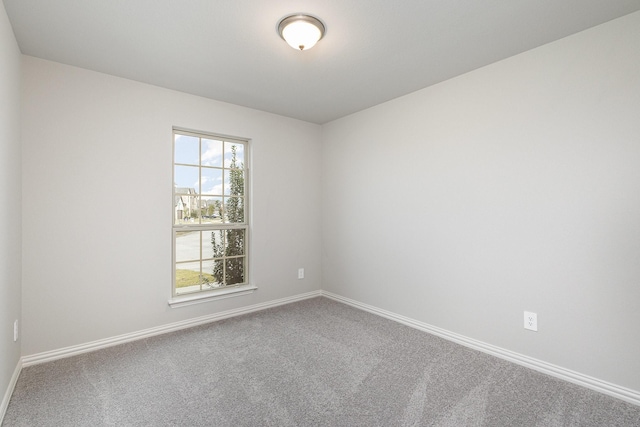 unfurnished room featuring carpet floors