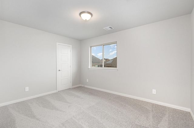 unfurnished room with carpet flooring