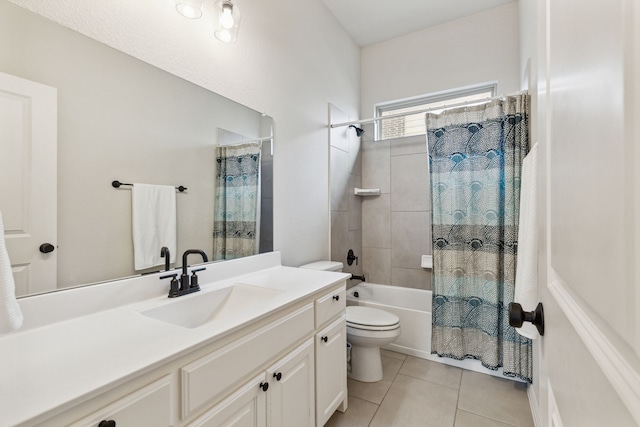 full bathroom featuring toilet, vanity, tile patterned floors, and shower / bathtub combination with curtain