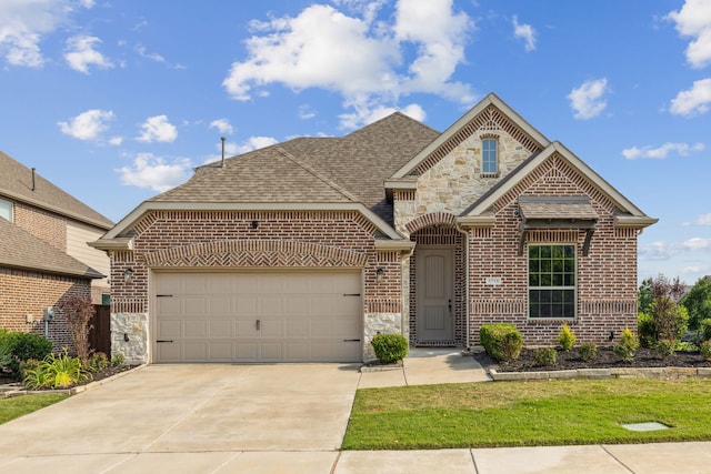 view of front of property with a garage