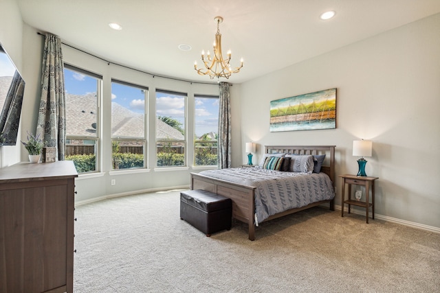 bedroom with light colored carpet and a chandelier