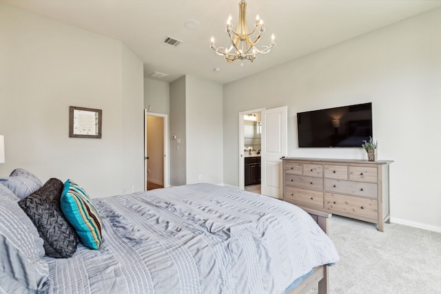 bedroom featuring a chandelier, light colored carpet, ensuite bath, and sink