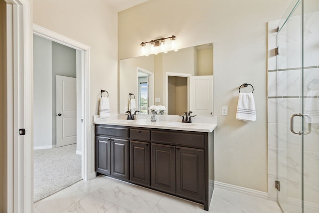 bathroom featuring vanity and a shower with shower door