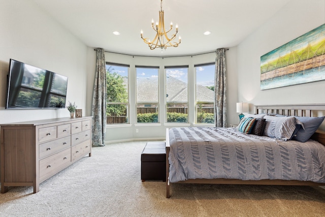 bedroom with light carpet and a chandelier