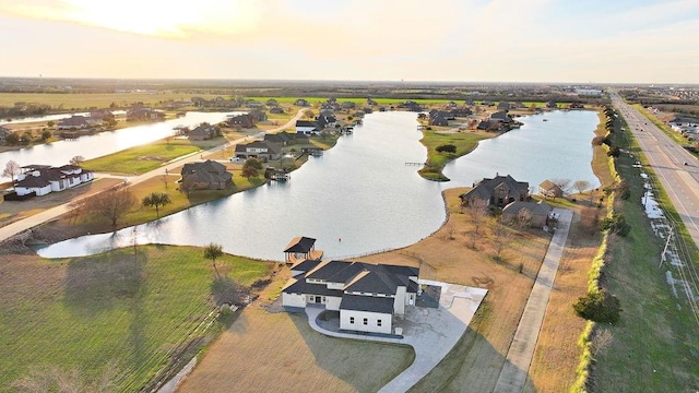 aerial view at dusk with a water view