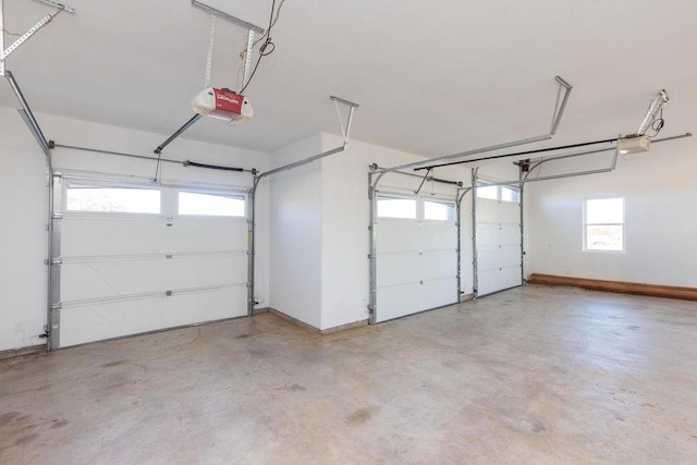 garage featuring baseboards and a garage door opener