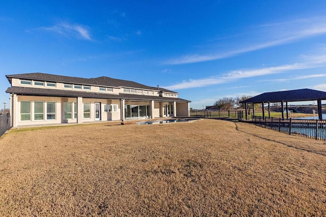 back of property featuring a patio area, a fenced backyard, and a yard