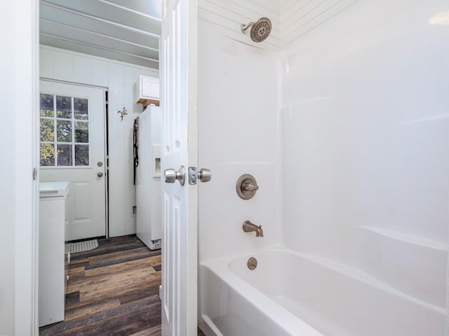 bathroom featuring shower / tub combination and wood-type flooring