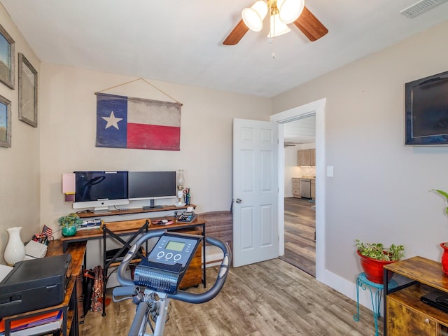 home office featuring hardwood / wood-style flooring and ceiling fan