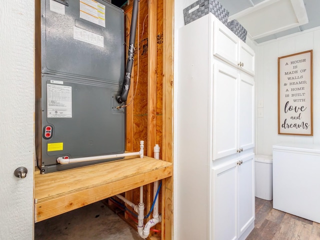 utility room with heating unit