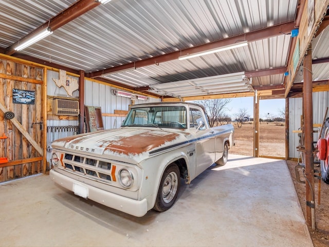 garage with a wall mounted air conditioner