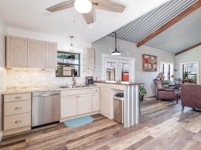 kitchen featuring hardwood / wood-style flooring, dishwasher, and decorative light fixtures