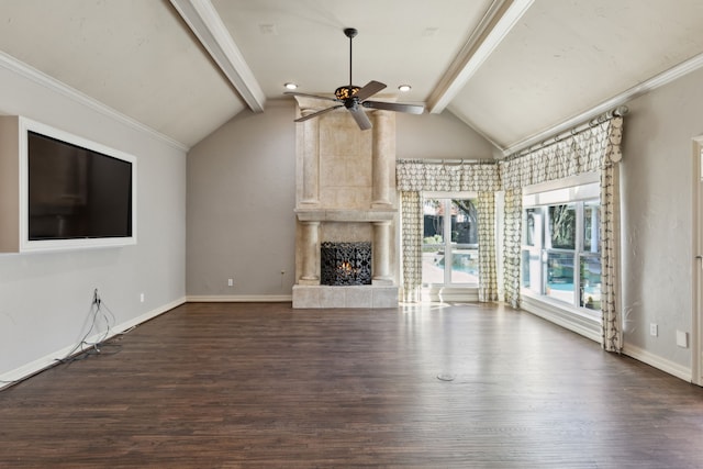 unfurnished living room with ceiling fan, dark wood-type flooring, a large fireplace, and vaulted ceiling with beams