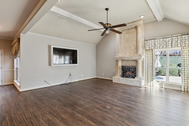 unfurnished living room with ceiling fan, dark hardwood / wood-style floors, vaulted ceiling with beams, crown molding, and a tiled fireplace