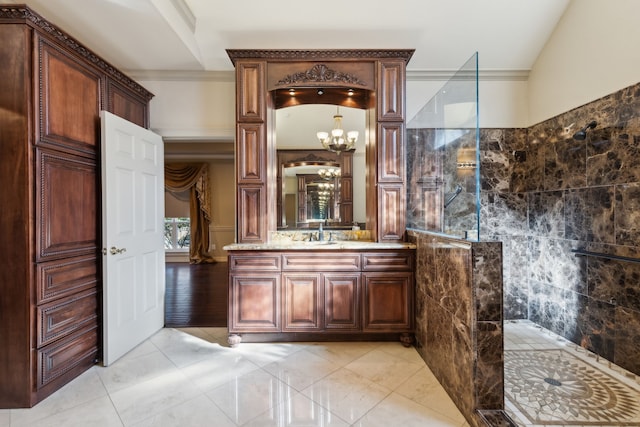 bathroom featuring vanity, a shower, and an inviting chandelier