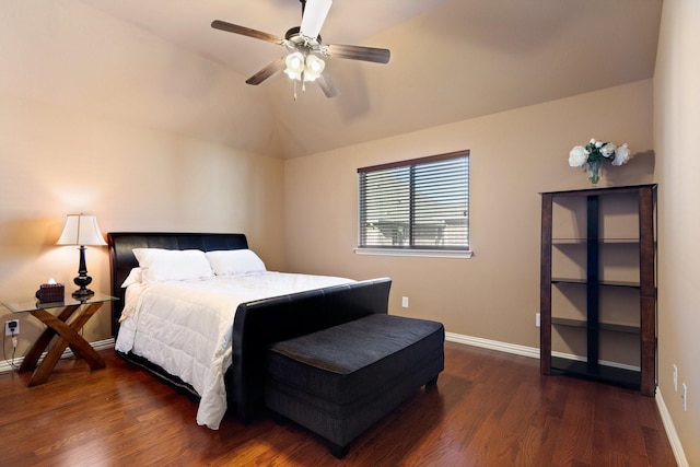 bedroom with ceiling fan, dark hardwood / wood-style floors, and vaulted ceiling