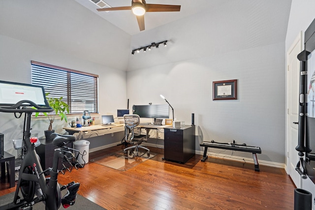 office space with hardwood / wood-style floors, ceiling fan, lofted ceiling, and rail lighting