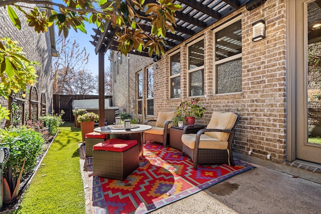 view of patio featuring a jacuzzi and a pergola