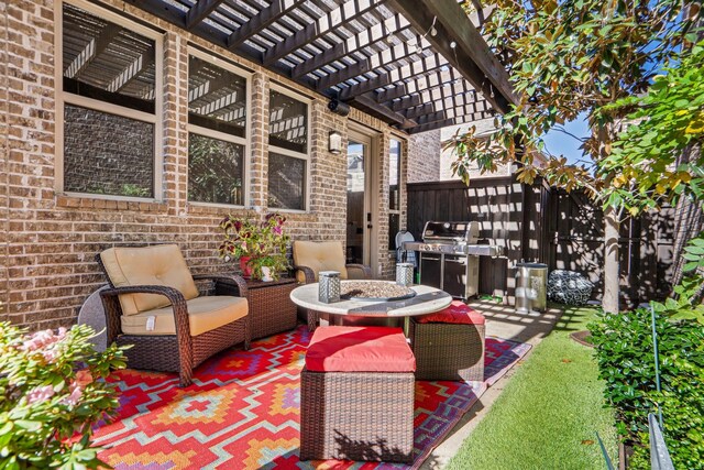 view of patio featuring area for grilling and a pergola