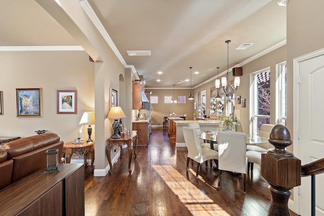 dining area featuring crown molding and dark wood-type flooring