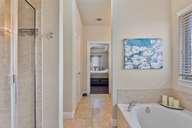 bathroom with a healthy amount of sunlight, tile patterned floors, and plus walk in shower