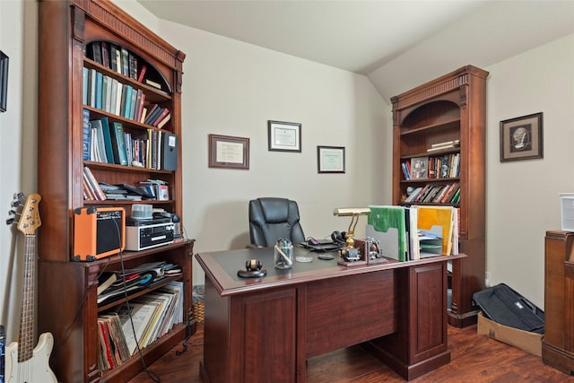 office with vaulted ceiling and dark hardwood / wood-style floors