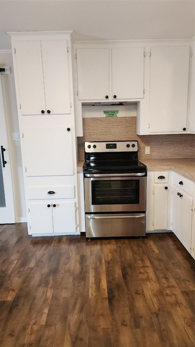 kitchen with white cabinetry, dark hardwood / wood-style flooring, decorative backsplash, exhaust hood, and electric stove