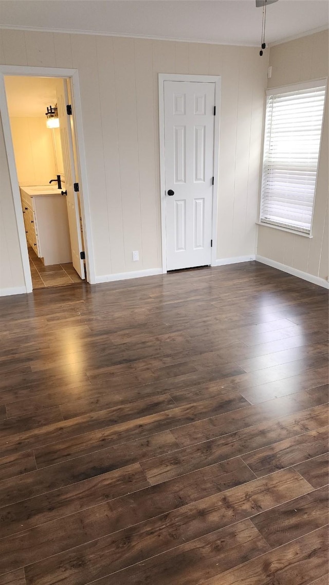 empty room featuring dark wood-type flooring