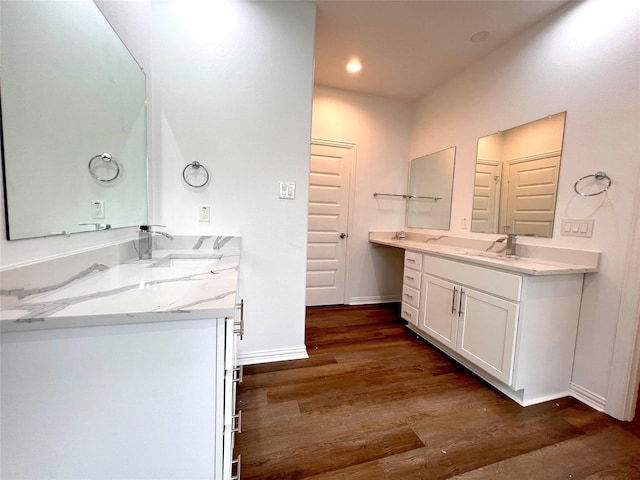 bathroom featuring vanity and hardwood / wood-style flooring