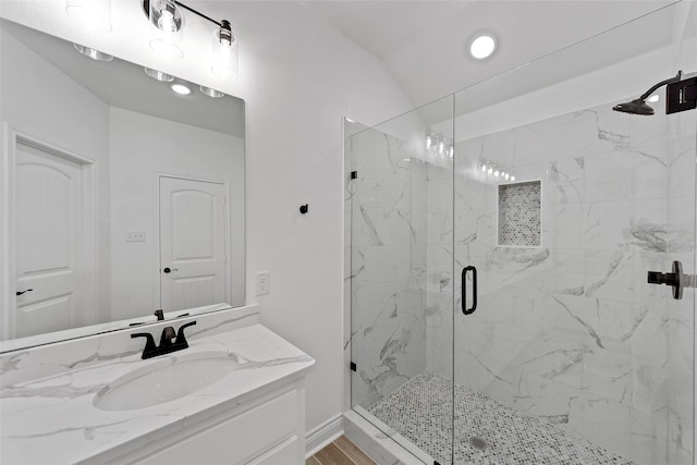 bathroom with vanity and an enclosed shower