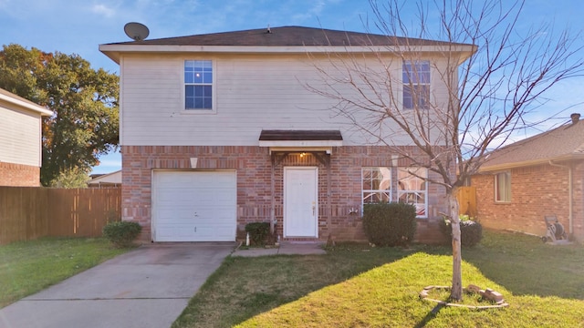 view of front of house featuring a front yard and a garage