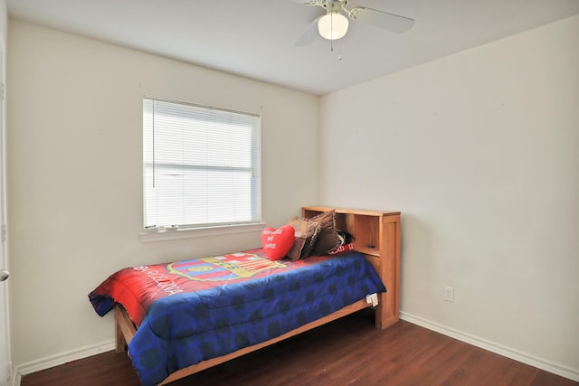 bedroom with ceiling fan and dark wood-type flooring