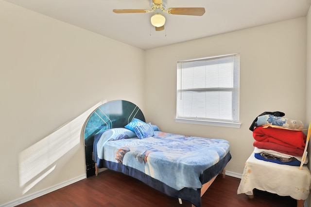 bedroom with ceiling fan and dark wood-type flooring