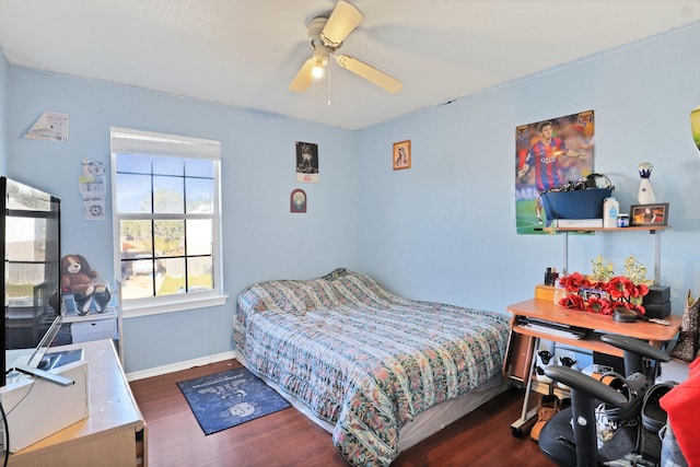 bedroom featuring ceiling fan and dark hardwood / wood-style floors