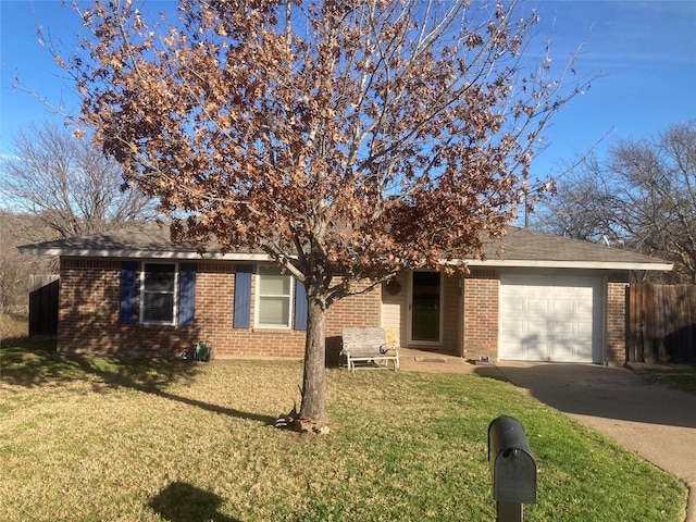 view of front of property featuring a garage and a front lawn