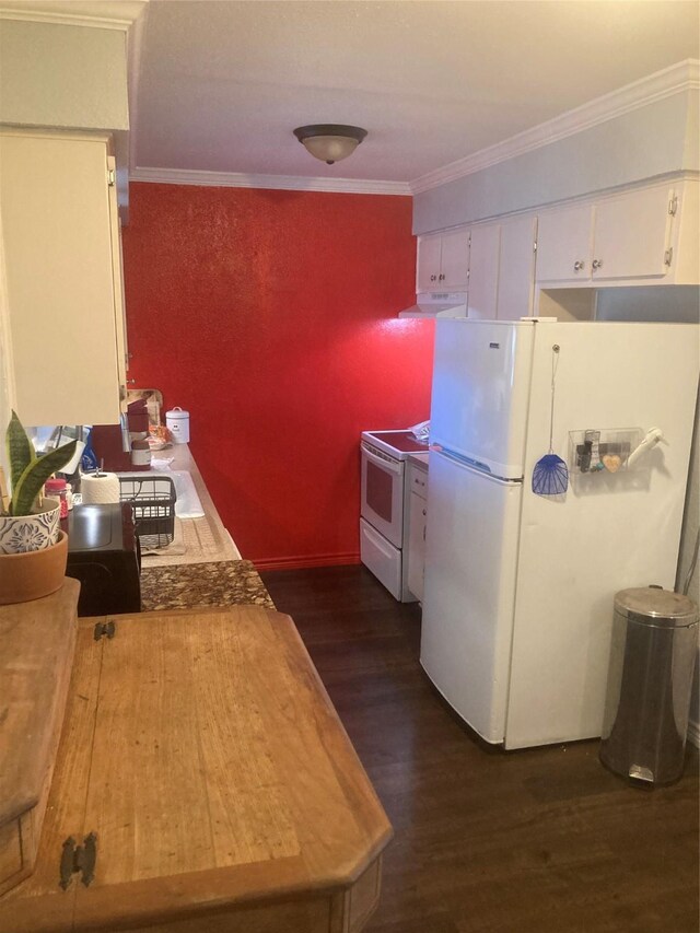 kitchen with white cabinets, dark wood-type flooring, white appliances, and ornamental molding