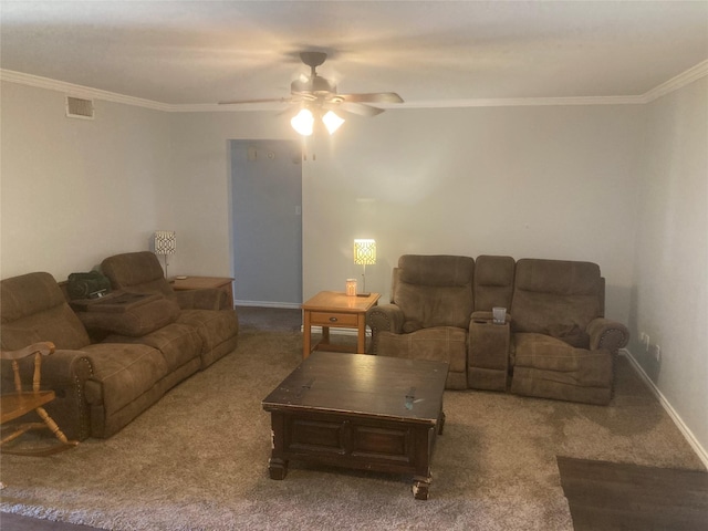 carpeted living room with ceiling fan and crown molding