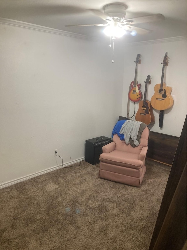 unfurnished room featuring ceiling fan, dark colored carpet, and ornamental molding