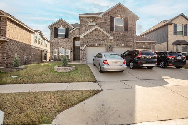 view of property featuring a garage and a front lawn