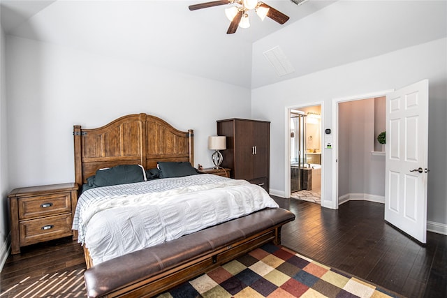 bedroom with ensuite bath, ceiling fan, dark hardwood / wood-style floors, and vaulted ceiling