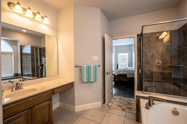 bathroom with plus walk in shower, tile patterned flooring, and vanity