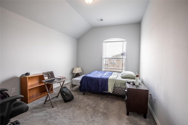 carpeted bedroom featuring lofted ceiling