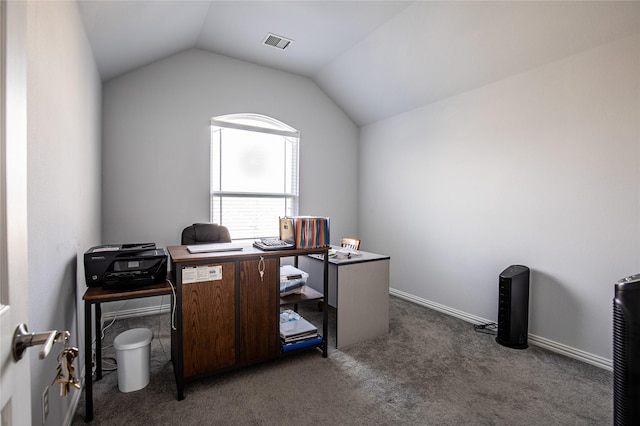 carpeted office space with vaulted ceiling