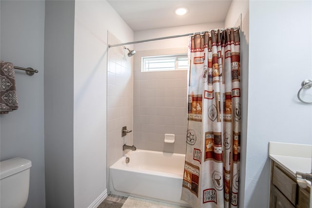 full bathroom with shower / tub combo with curtain, vanity, and toilet